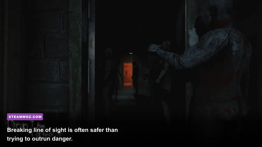 David hiding from an enemy in a dark hallway in Don't Be Afraid