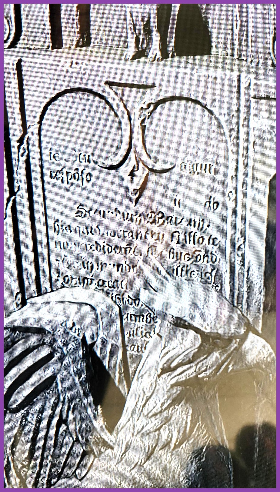 A gravestone memorial dedicated to Robbie Coltrane near the Black Lake in Hogwarts Legacy