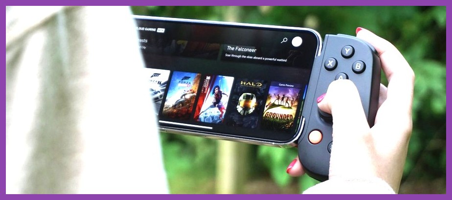 An iPhone mounted into a handheld controller playing an intense modern action game