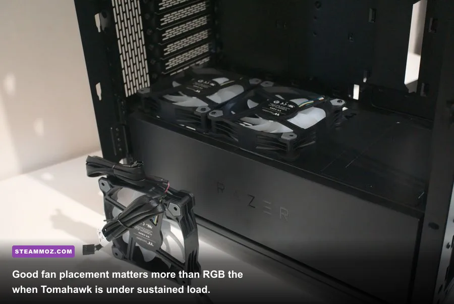 Open Razer Tomahawk ATX PC case showing graphics card fans and cable management