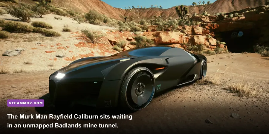 Matte black Rayfield Caliburn parked inside a dark shipping container in the Badlands cave