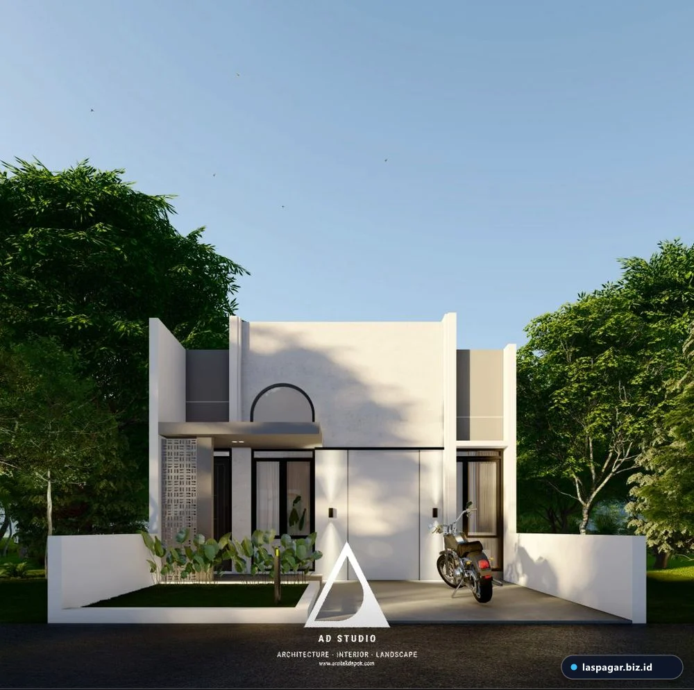 taman depan rumah minimalis type 36 modern dengan tanaman hijau dan batu alam