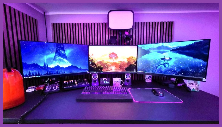 A cozy RGB PC gaming setup with dual monitors