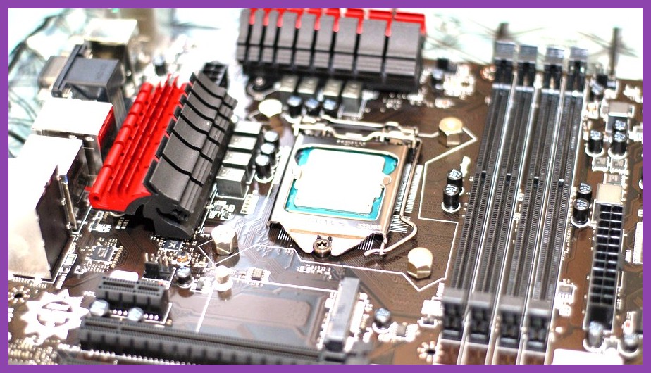 Close‑up of DDR5 RAM modules being installed in a motherboard
