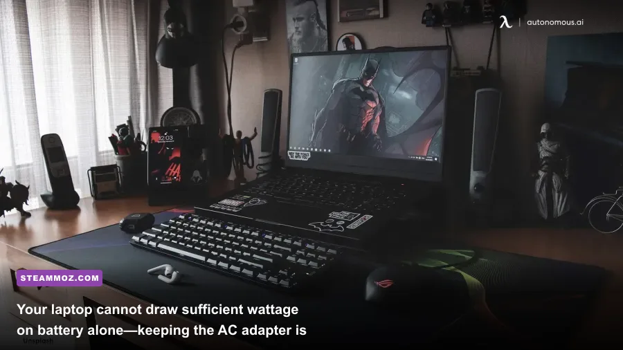 Heavy-duty gaming laptop power brick connected to a high-end portable gaming rig