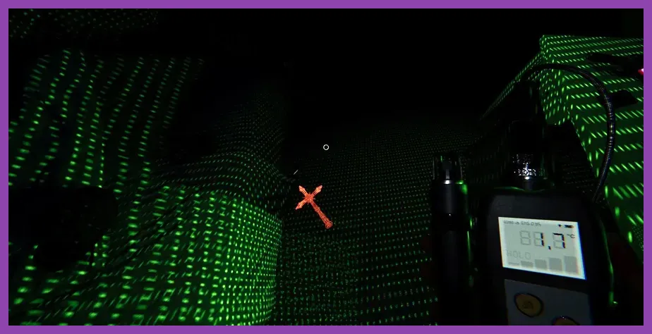 Player using UV light in Phasmophobia ghost room