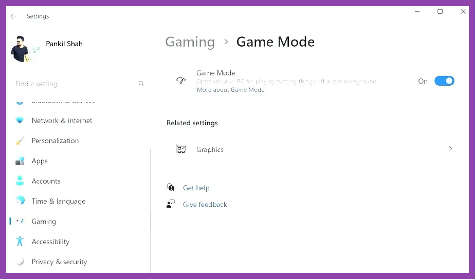 Gamer holding Lenovo Legion Go in handheld mode