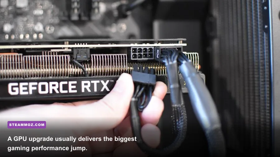 Graphics card being installed in a desktop gaming PC with PCIe power cable visible